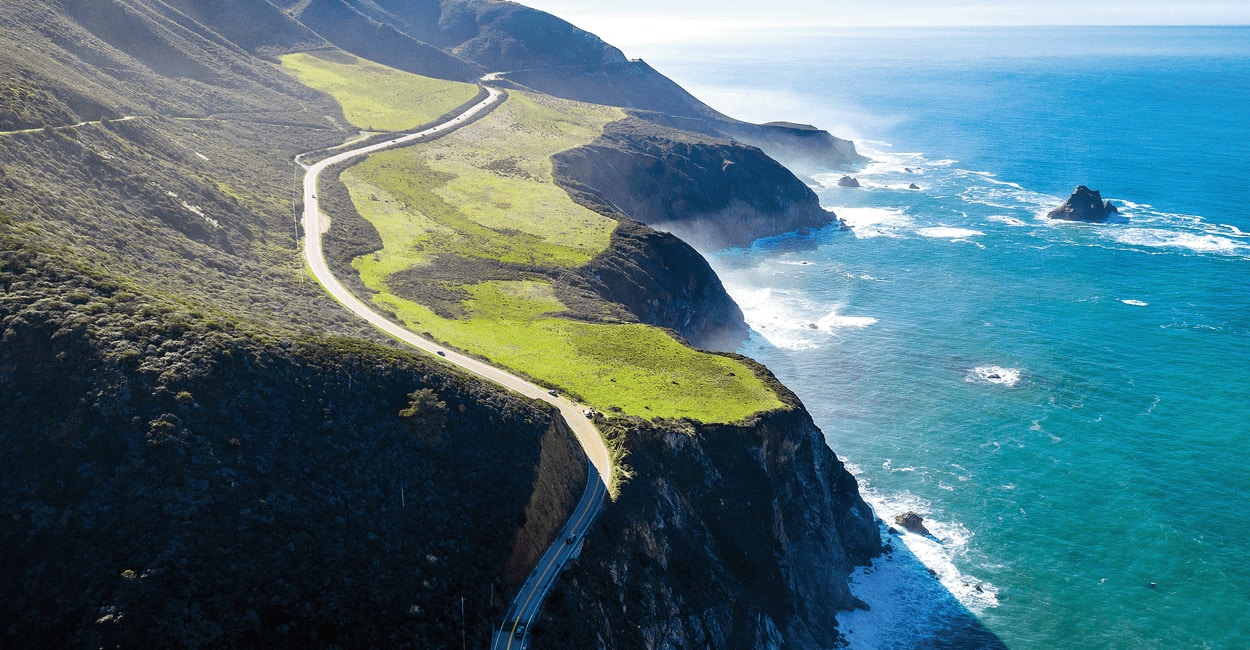 A remote coastal road along a cliff.