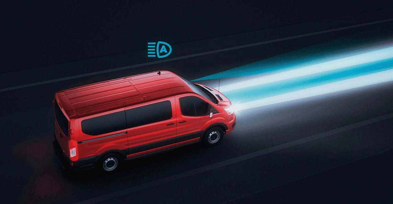 AN illustration of a red Transit with its headlights on.